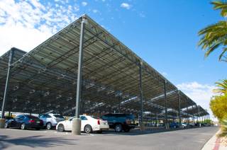 Giant solar panels structured over the parking area provide the energy needed to manufacture the products at ProCaps Laboratories, Monday July 25th, 2011.